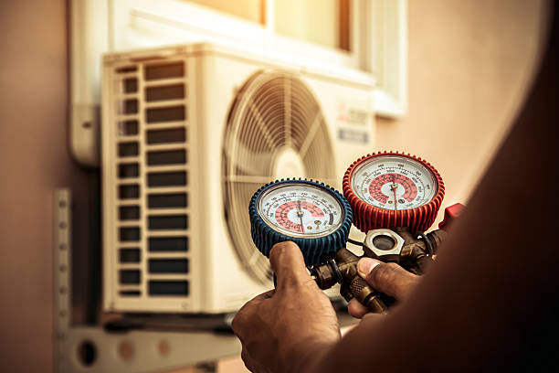 Professional Air Conditioning Service technician working in Divide, CO